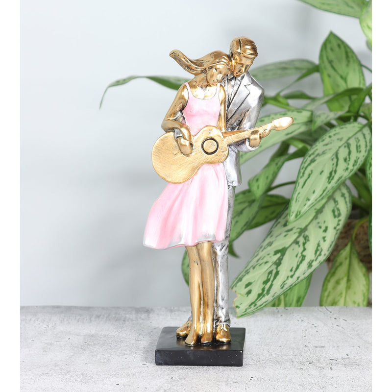 Poly couple with guitar, 14 x 8.5 x 30 cm, old pink