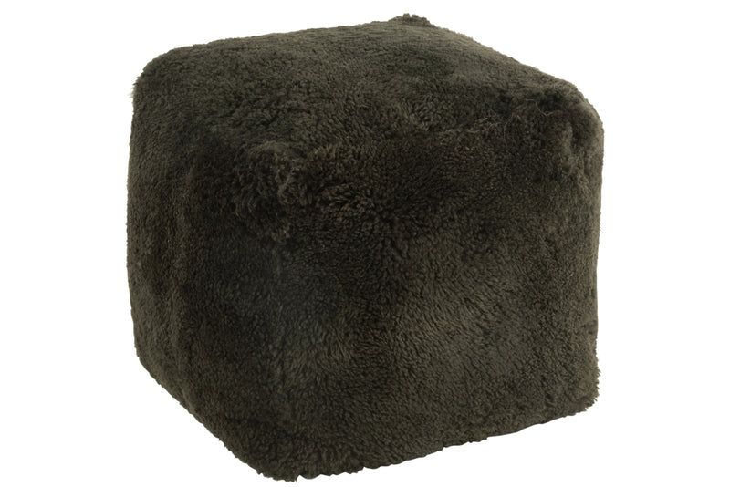 Stylish square stool with sheepskin in green Design meets comfort