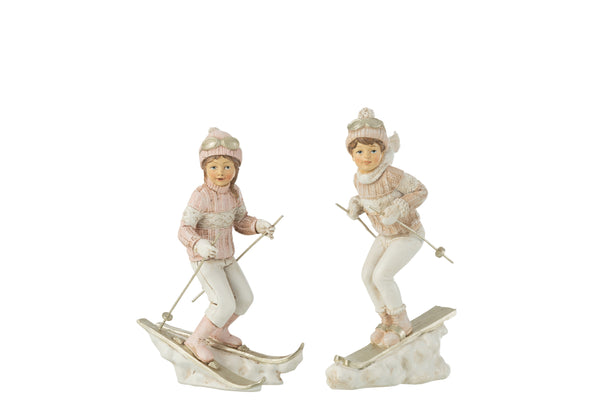 Set van 4 handbeschilderde kerstfiguren, meisjes en jongens op ski's, wit/roze