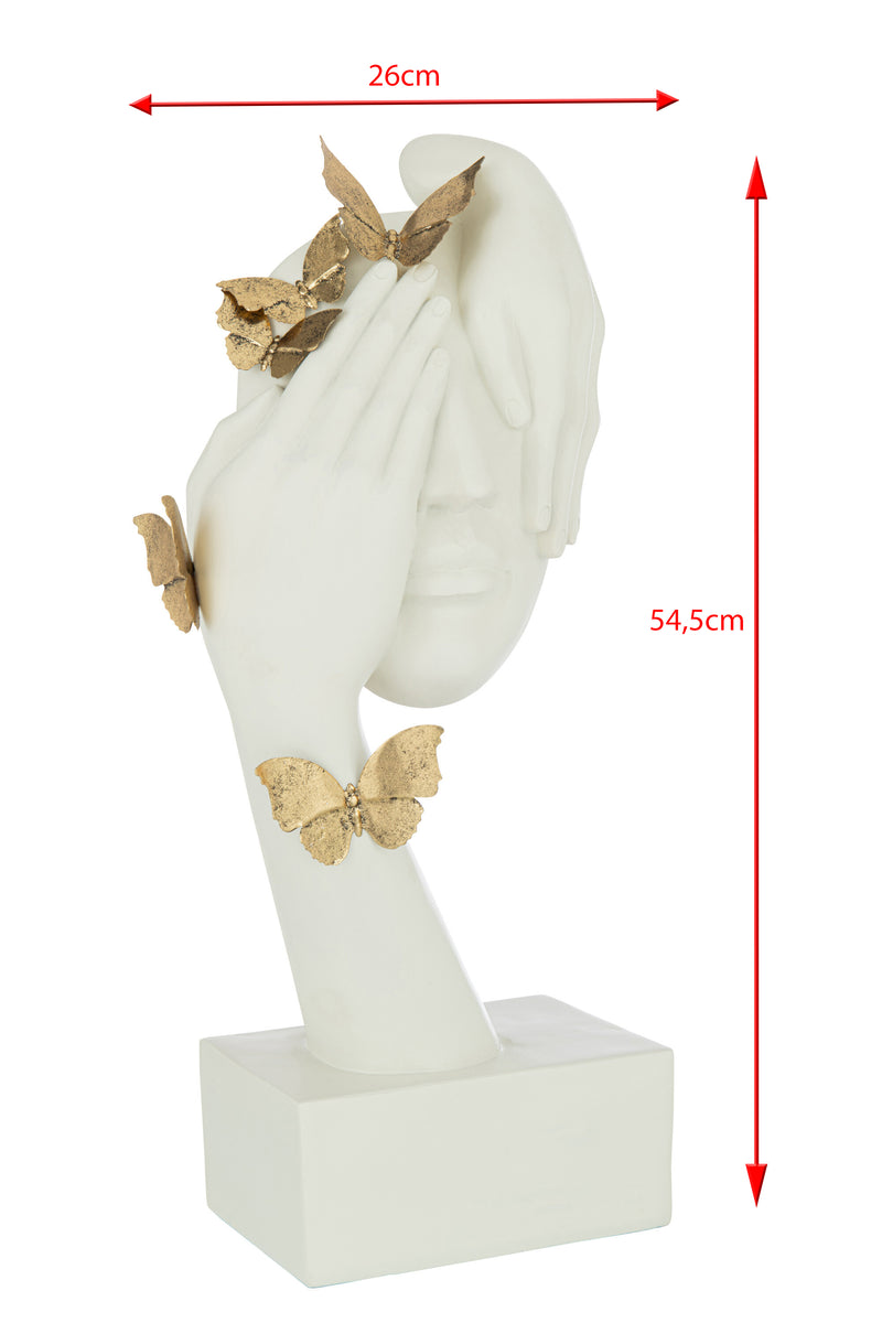 Elegant butterfly face sculpture in gold and white - symbol of freedom and change