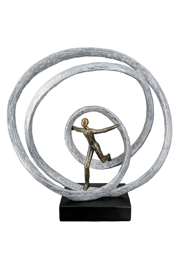 Beeld 'Bevrijding' met figuur en cirkels van hars - inspirerend kunstwerk