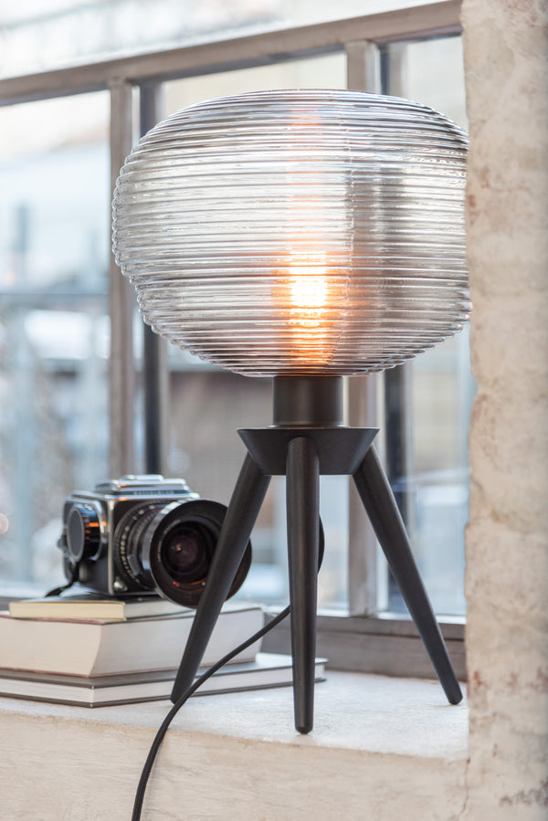 Table lamp Teri with tripod frame made of grey/black wood and glass lampshade