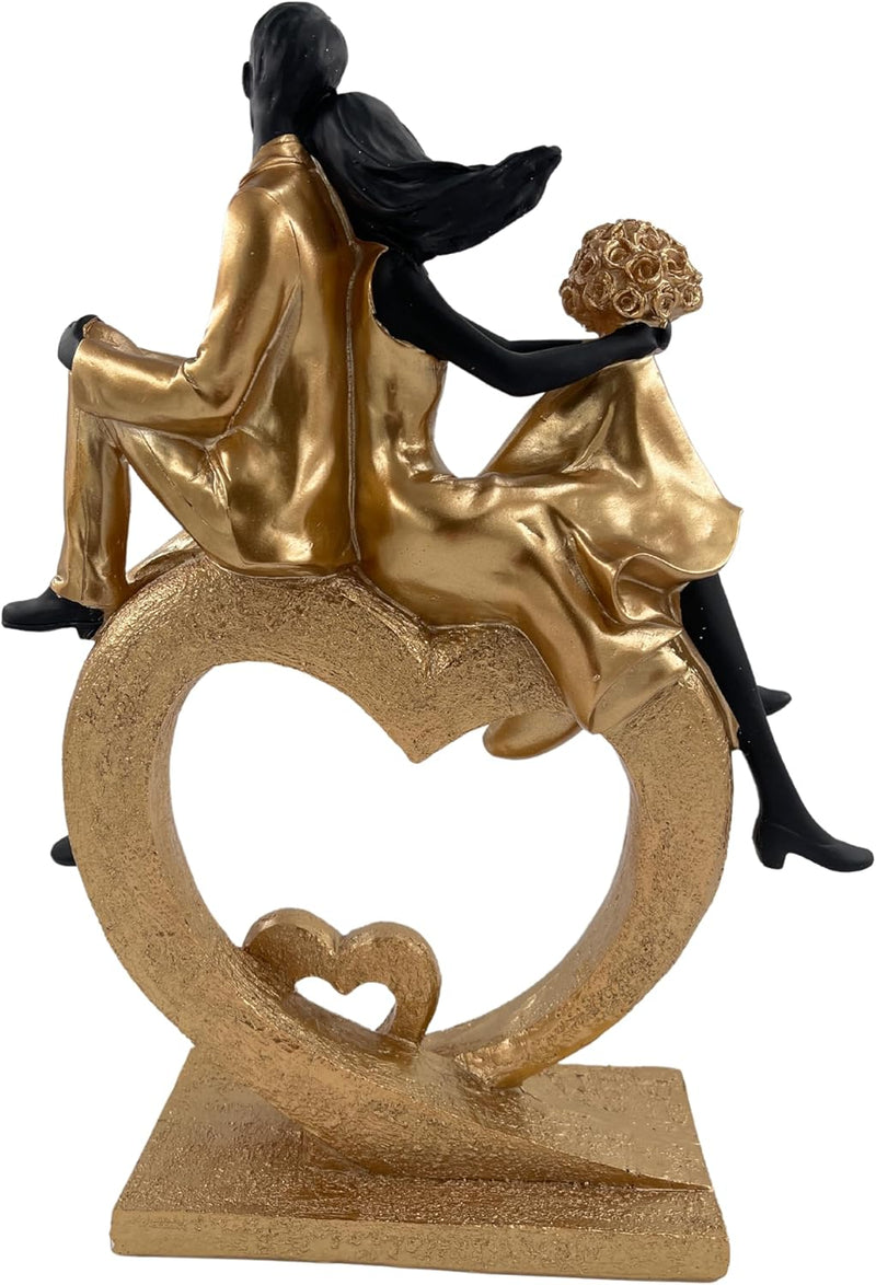 Elegante Skulptur eines sitzenden Paares in Herzform, Schwarz und Gold