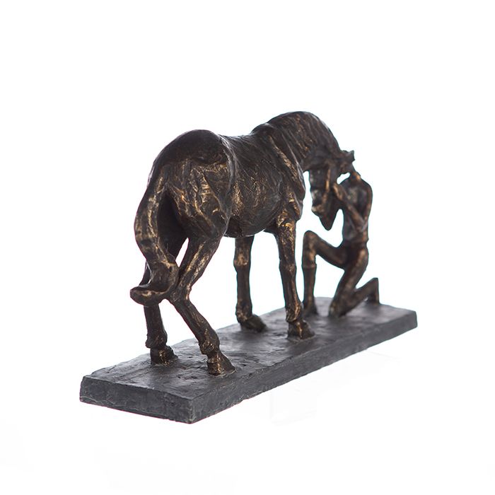 Sculpture Comprehension - Bronze-colored depiction of a horse with a rider on a gray base including a saying pendant