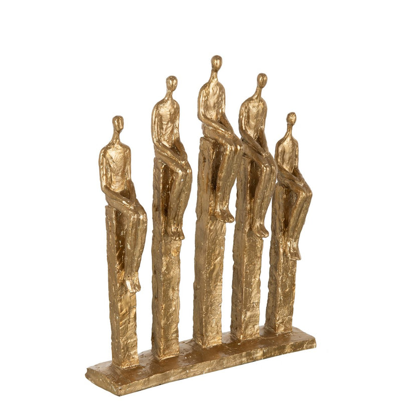 Modern sculpture in gold with stylized figures