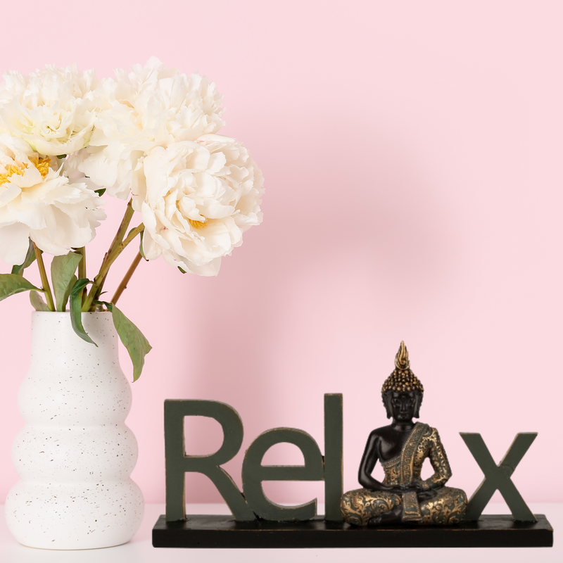 Decorative lettering Relax with Buddha figure in black