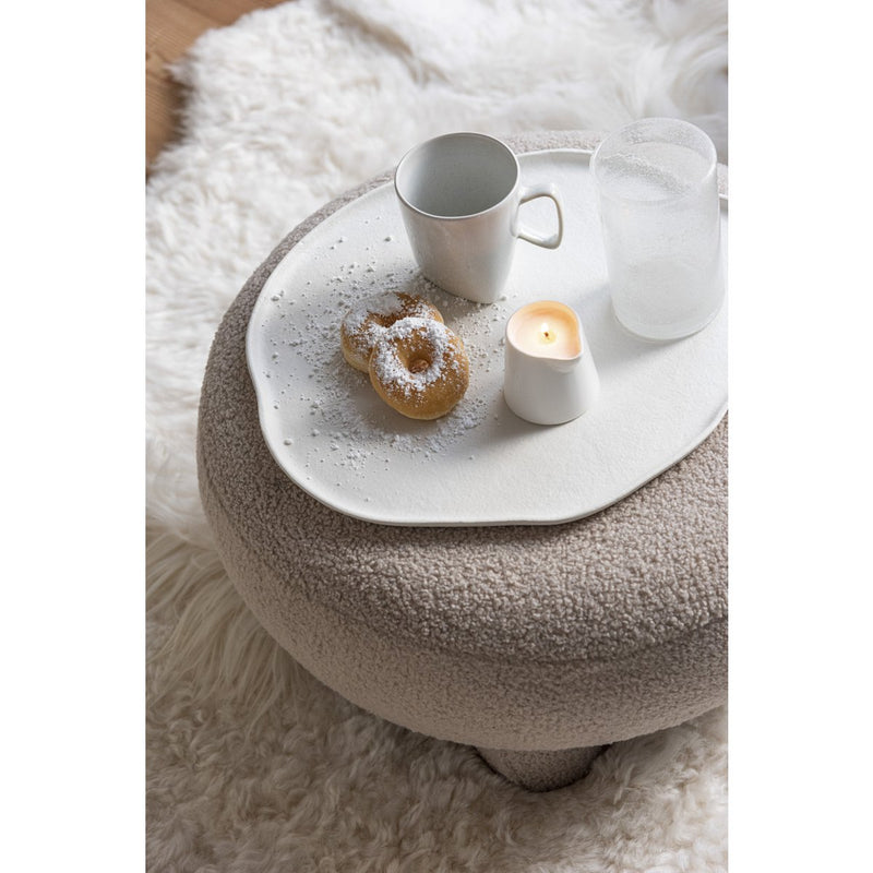 Round stool made of teddy bouclé in warm beige