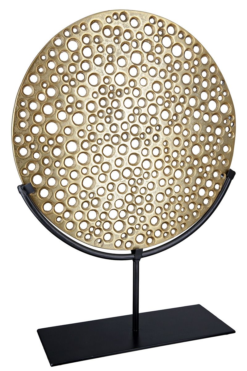 Hive - Gold-colored, perforated object on a black metal stand by GILDE